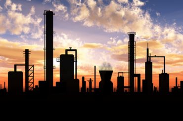 Oil refinery factory over sunrise